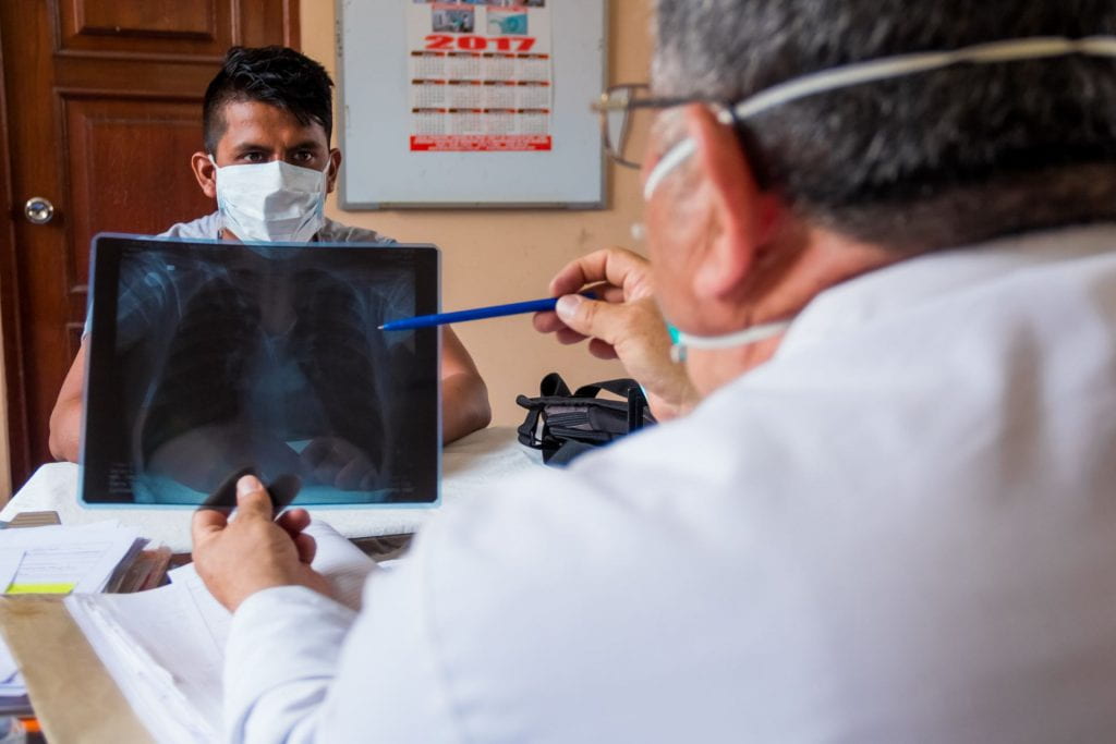 Doctor examining X-ray for patient in Peru